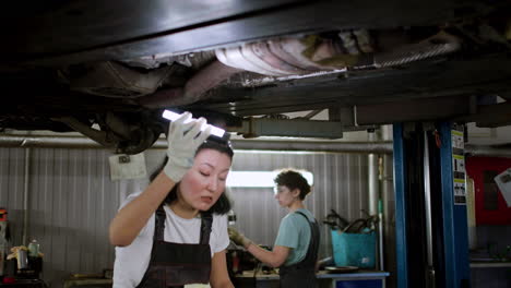 Woman-inspecting-automobile