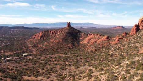 drone shot of sandstone rock formations, towers and cliffs above sedona arizona usa