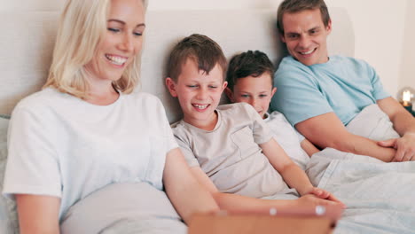 tablet, smile and parents with children in bed