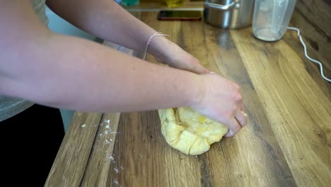 Woman-Dough-Kneading-on-a-Kitchen-Counter