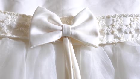 grand white dress, close up the bow and lace details