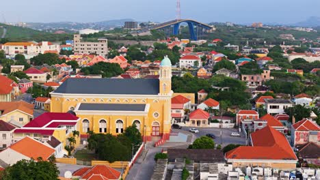 aerial wide angle establishes santa famia church and queen juliana bridge otrobanda curacao