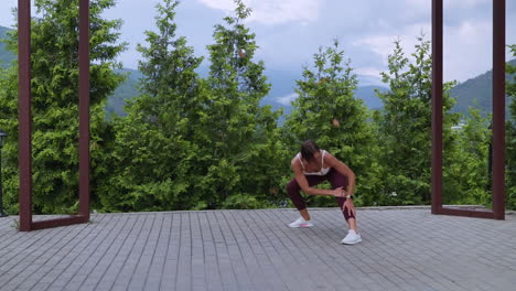 woman stretching outdoors in nature