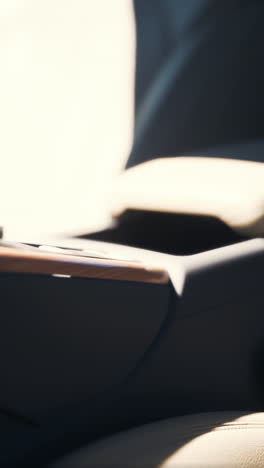 close-up of a car interior with leather seats and sunlight