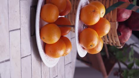 stack of oranges on a plate