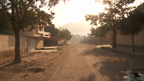 A-POV-walk-along-a-street-in-Kabul-Afghanistan-reveals-a-building