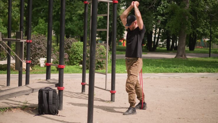 Park Warmup And Ritual With White Male Adjusting Cap And Concentrating Before Workout, Backpack On Ground, Quiet Morning With Trees, Anticipation And Mental Focus Before Training Session