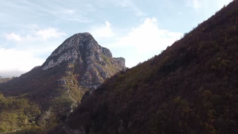 Aerial-landscape-view-of-Monte-Cigno-peak-and-forest,-in-the-Apennine-mountains,-Italy