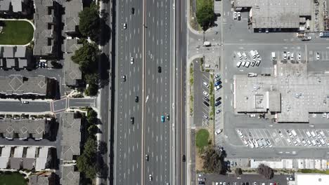 top down pan up view of highway traffic on 101 roof top solar panels pan handle garden