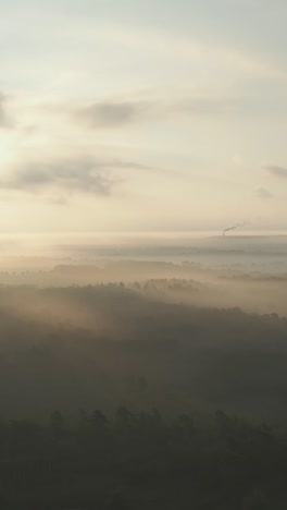 misty sunrise landscape with industrial view