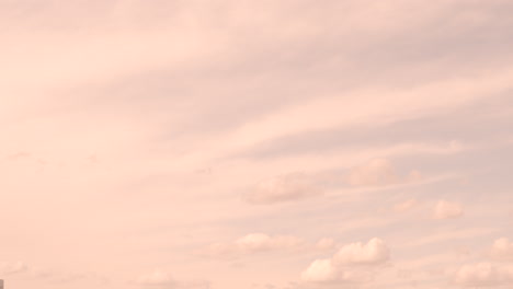time lapse of a sunset lit sky full of clouds
