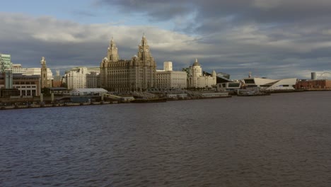 sweeping drone shot rising over liverpool city skyline