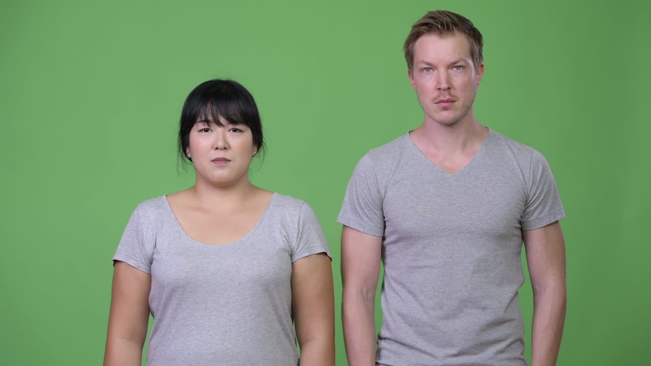 Young multi-ethnic couple smiling together