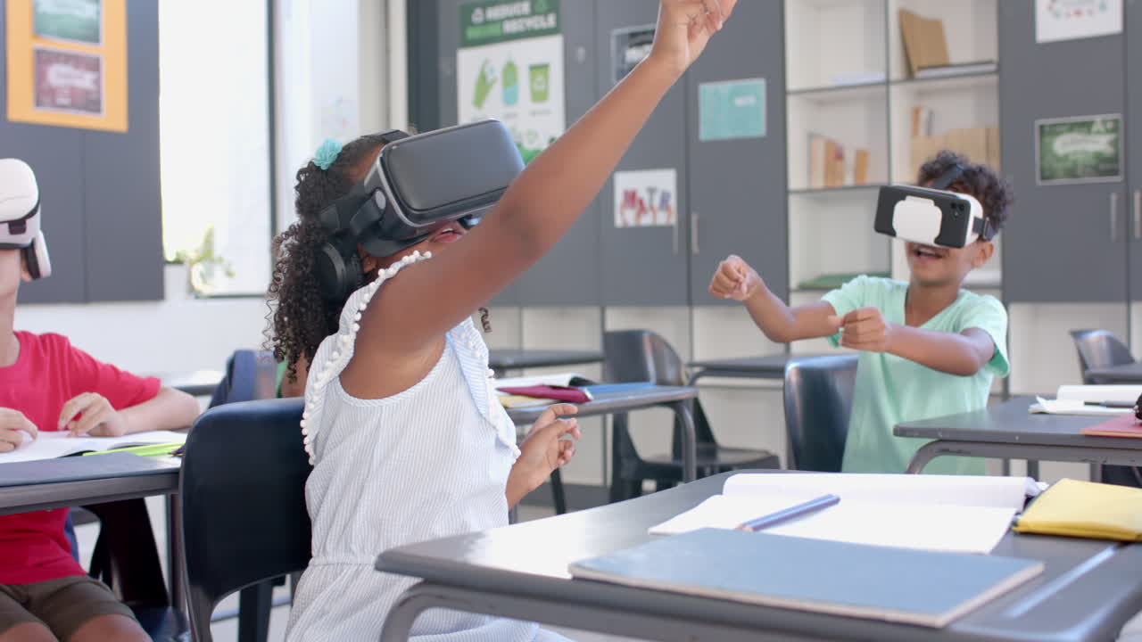 Biracial children engage in a VR lesson at school in the classroom