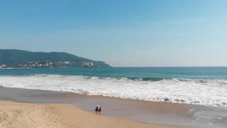 Shore-of-the-beach-with-drone-entering-the-sea