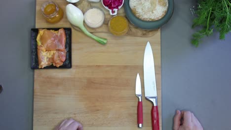 cutting bread before cooking in the kitchen