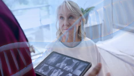 Animation-of-dna-strand-rotating-over-diverse-male-doctor-with-tablet-and-senior-female-patient