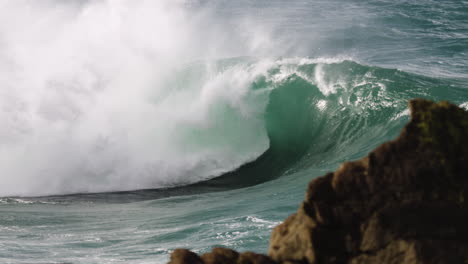 stormy wave explodes onto a rock shelf