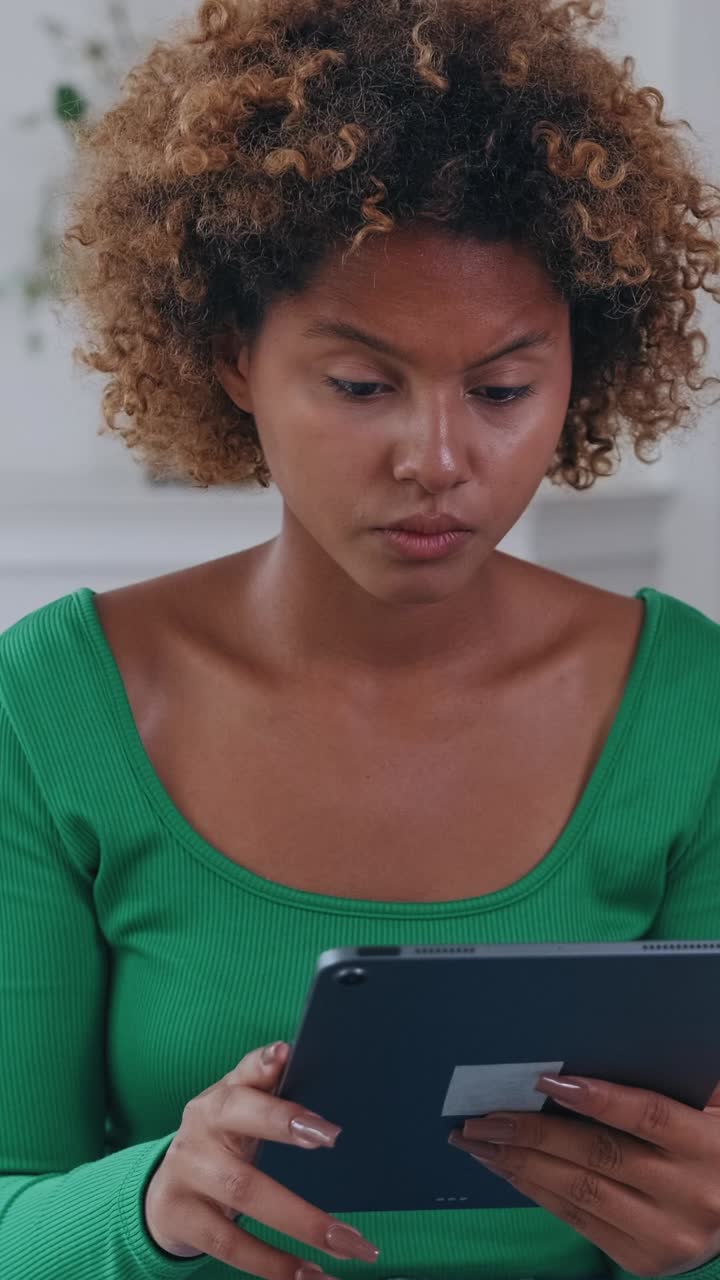 Engaging with digital content on a tablet in a cozy living room setting