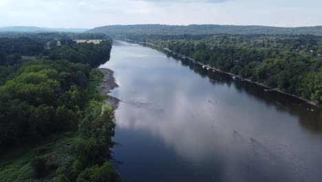 flying over the delaware river on a sunny cloudy day