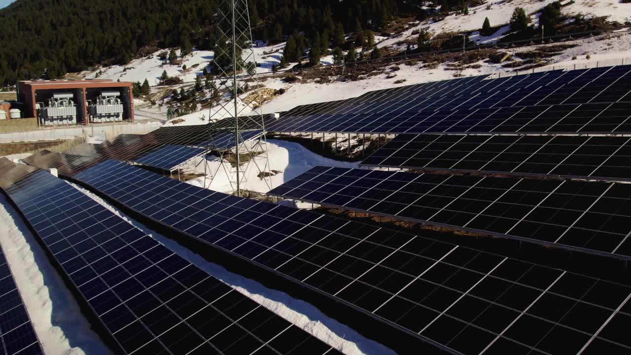Solar panels on the mountain side, aerial close up detail