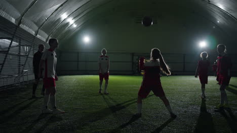 girls indoor soccer team practicing