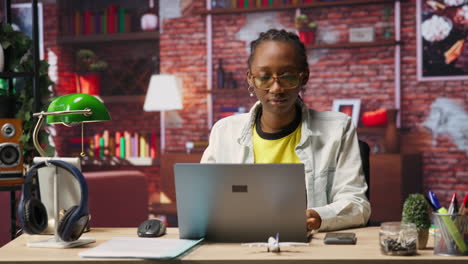 freelancer in home office opening laptop, starting working on tasks