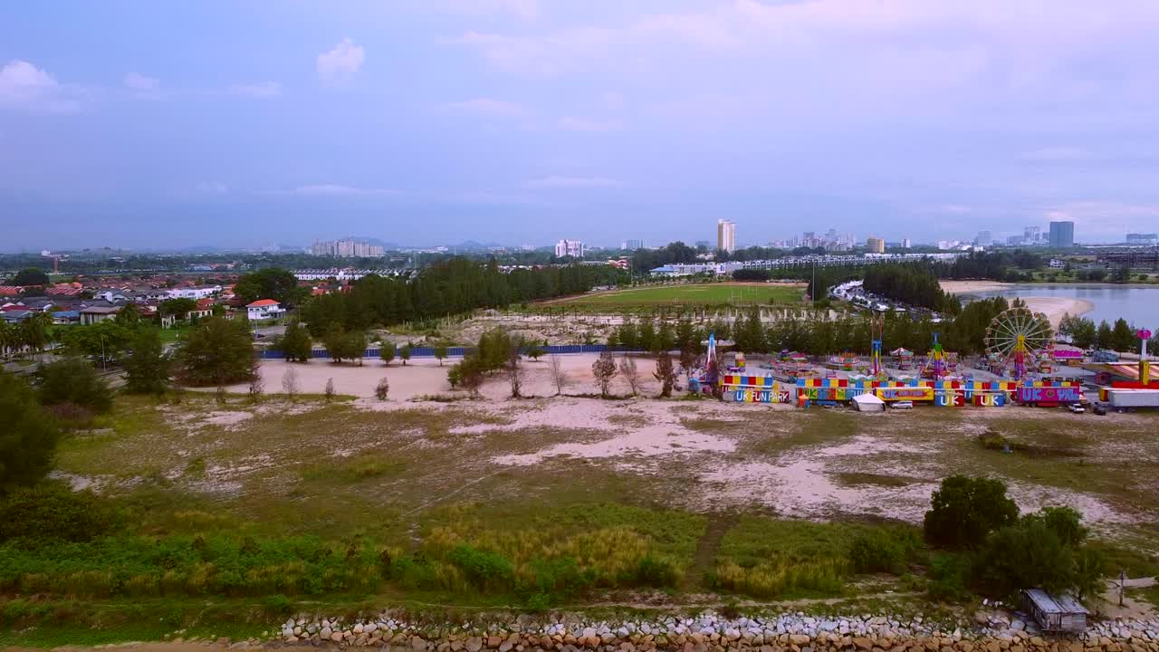 A Market and Fun Carnival in the sand dunes and Melaka submarine at Kuala Lumpur, Malaysia  - Aerial Shot