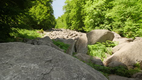 Felsenmeer-in-Odenwald-Sea-of-rocks-wood-nature-landscape-tourism-on-a-sunny-day-steady-movement-shot