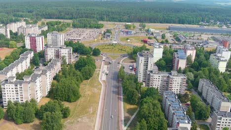 apartment building and street traffic in suburbs of kaunas city, aerial view