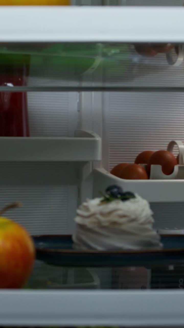 Person looking inside refrigerator