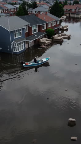 severe flooding in a residential area with a boat and submerged homes