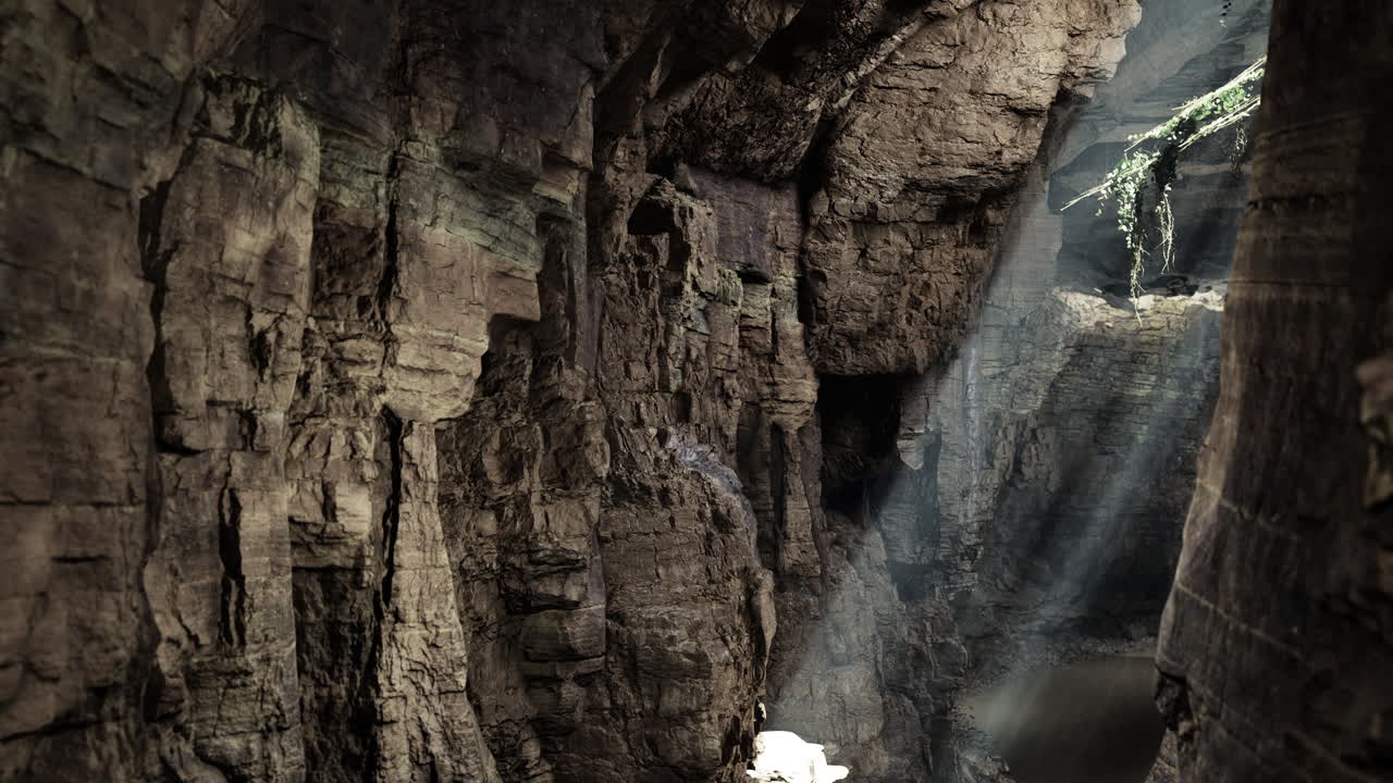 Light beams illuminate a stunning cavern with rocky textures and shadows