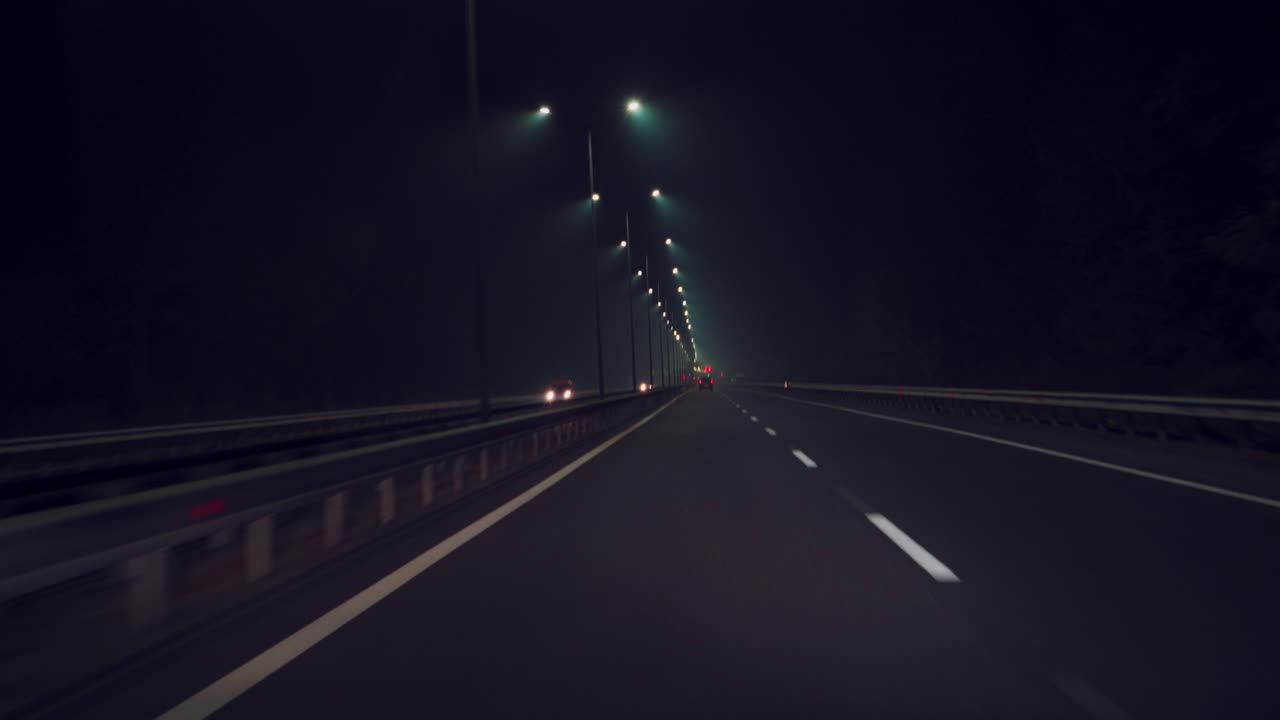 car is driving quickly along the highway in the dark. Night travel by car. Movement speed
