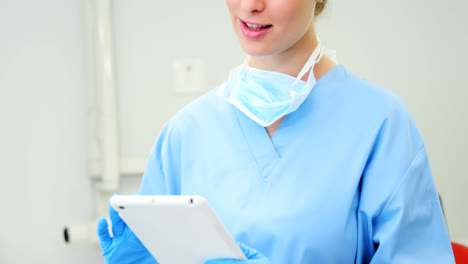 female nurse using digital tablet