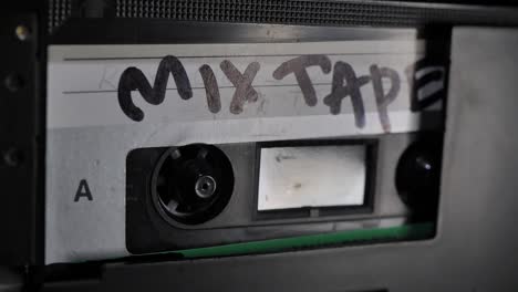 Cassette Tape. Vintage Tape Recorder Plays Audio Cassette tape inserted therein. Static shot.