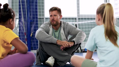 man and children sitting on the floor