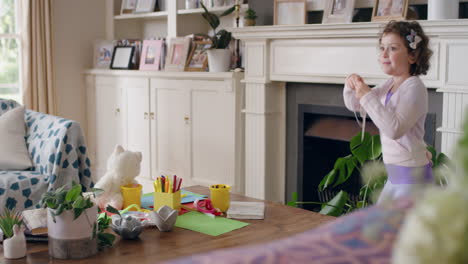 cute little girl playing dress up having fun wearing funny mask enjoying playful childhood imagination at home 4k