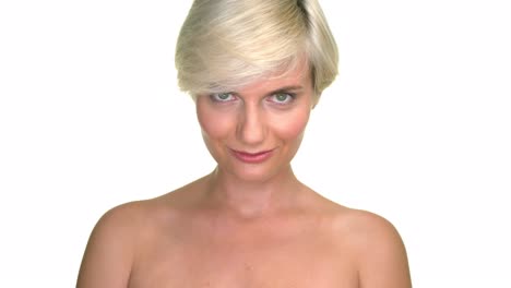 studio portrait on white background of attractive adult woman looking on camera with gentle smile