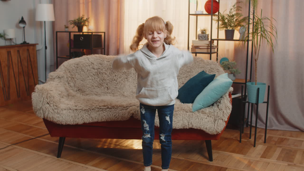 Young teenager girl kid doing easy squat exercise at home counting out loud flop with smile finish