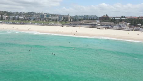 Surfers-In-Clear-Blue-Sea