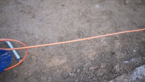 close up of cable stretched out of cable reel extension drum