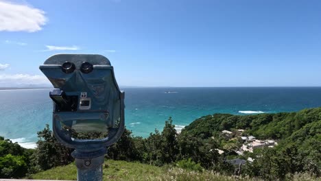 stationary binoculars overlooking a vibrant coastal landscape