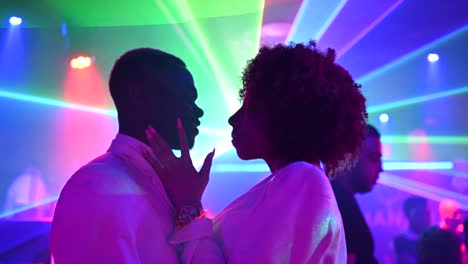 ethnic couple dancing in nightclub