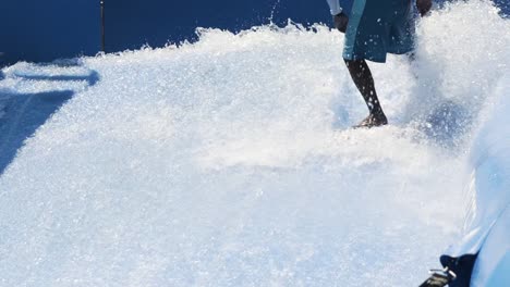 skilled surfer rides wave machine