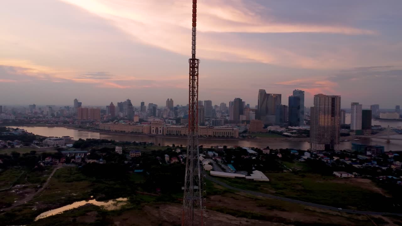 Phnom Penh Skyline at Sunset, Mekong River, and Cityscape. Aerial View