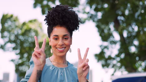 Black-woman-with-face-and-peace-hand-sign