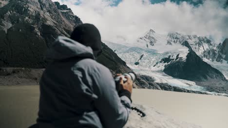 Hiker-Taking-Photos-At-Laguna-Torre-In-Argentina---Medium-Shot