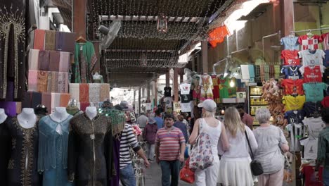 local dubai deira market with persistent sellers wooing tourists