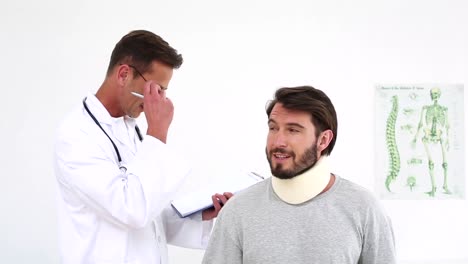 doctor checking on injured patient in a neck brace